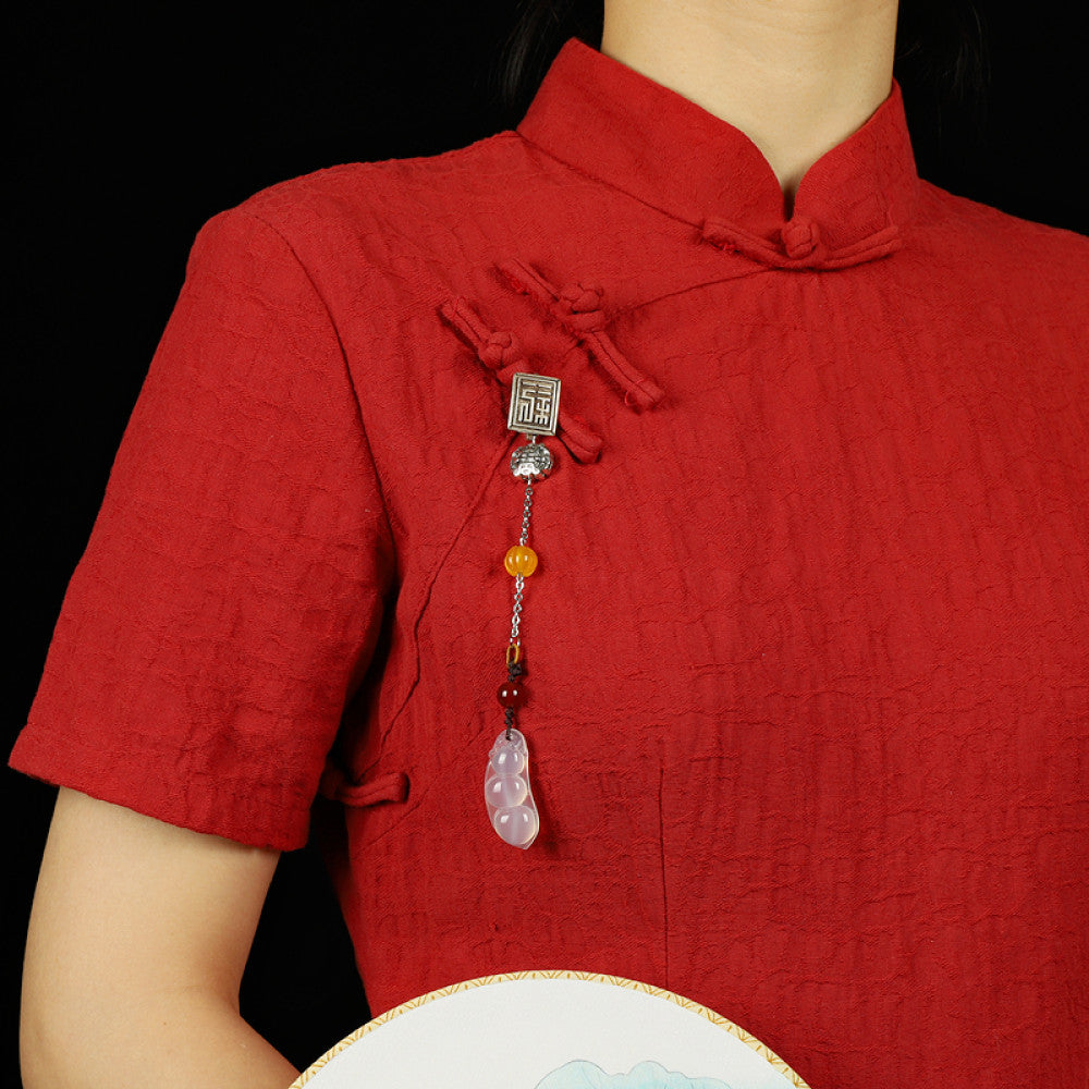 Boho vintage ethnic silver hair pendant featuring Fu character detail, yellow/red bead accents, and a jade bean-shaped charm, styled on a wooden display hook against a black background, ideal for bohemian and traditional fashion enthusiasts in the US 03