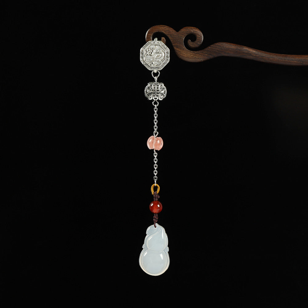 Boho vintage ethnic silver hair pendant featuring a ruyi-shaped jade charm, pink/yellow/red bead accents and decorative clasps, styled on a wooden display hook, ideal for bohemian and traditional fashion enthusiasts in the US