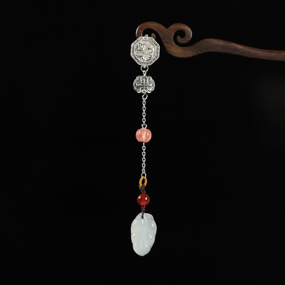 Boho vintage ethnic silver hair pendant featuring a ruyi-shaped jade charm, pink/yellow/red bead accents and decorative clasps, styled on a wooden display hook, ideal for bohemian and traditional fashion enthusiasts in the US
03