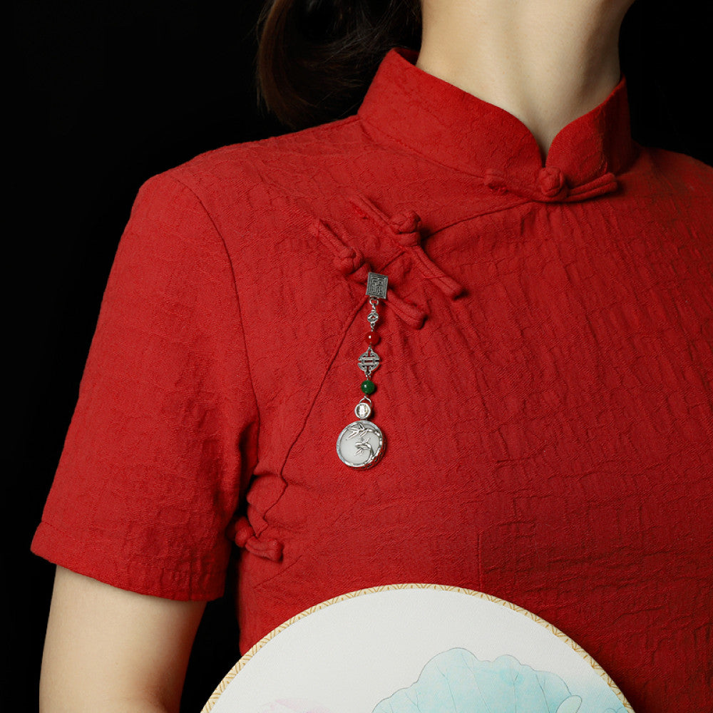 Boho vintage ethnic silver pendant charm featuring fu character, red & green beads, and a carved round plaque, styled on a display hook, ideal for bohemian and traditional fashion enthusiasts in the US 03