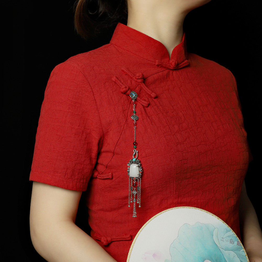 Boho vintage ethnic silver statement pendant with colorful beads, white gemstone center and tassel details, styled on a display hook, ideal for bohemian and traditional fashion enthusiasts in the US 02