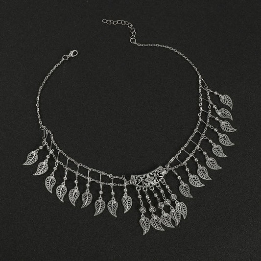 Boho vintage ethnic silver-tone hair clip ornament (displayed on a black background) featuring leaf-shaped dangle fringe and an ornate central decorative piece