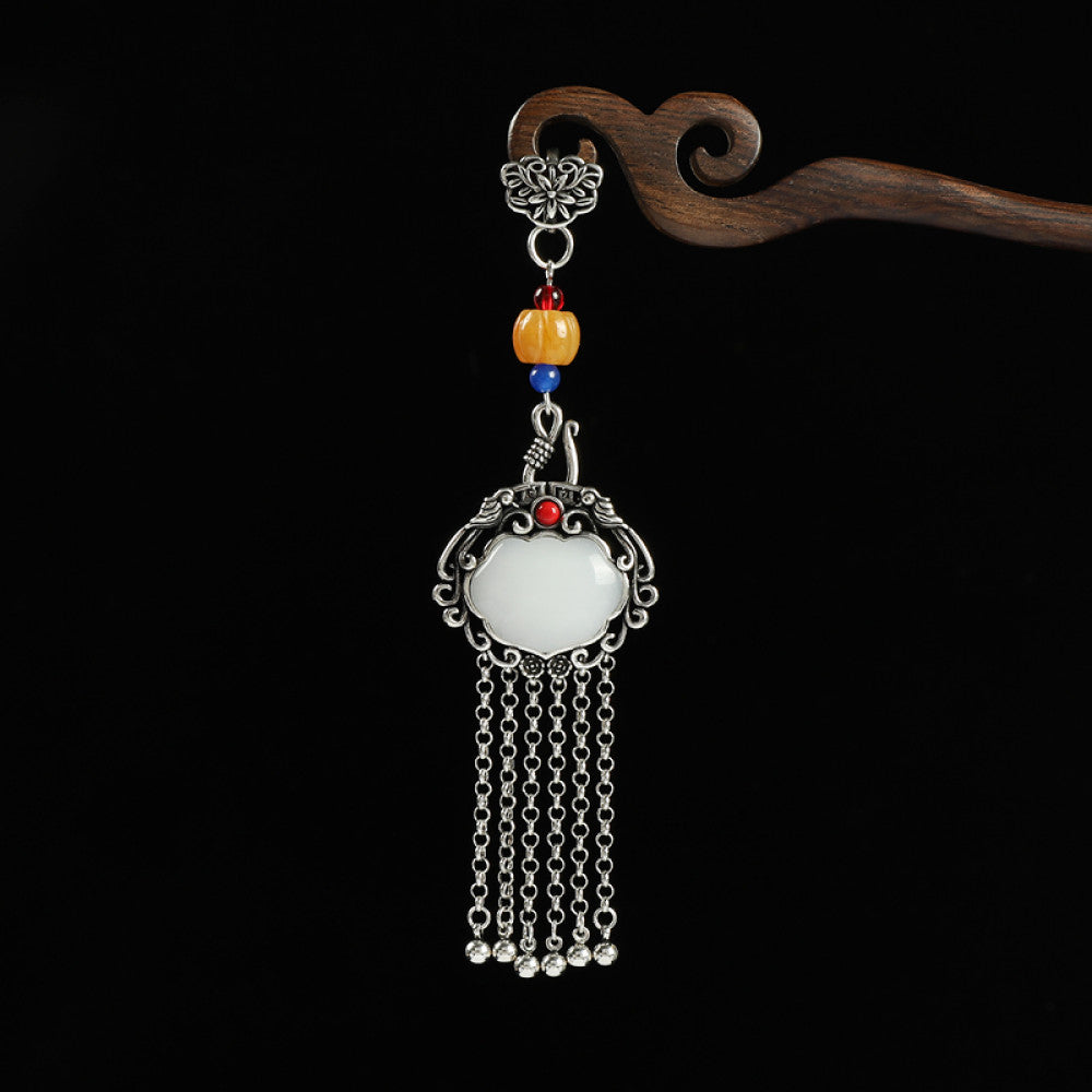 Boho vintage ethnic silver-tone hair pendant featuring Fu character detail, yellow/blue bead accents, red gemstone decoration, white lock-shaped pendant and silver tassel details, styled on a wooden display hook against a black background, ideal for bohemian and traditional fashion enthusiasts in the US 01