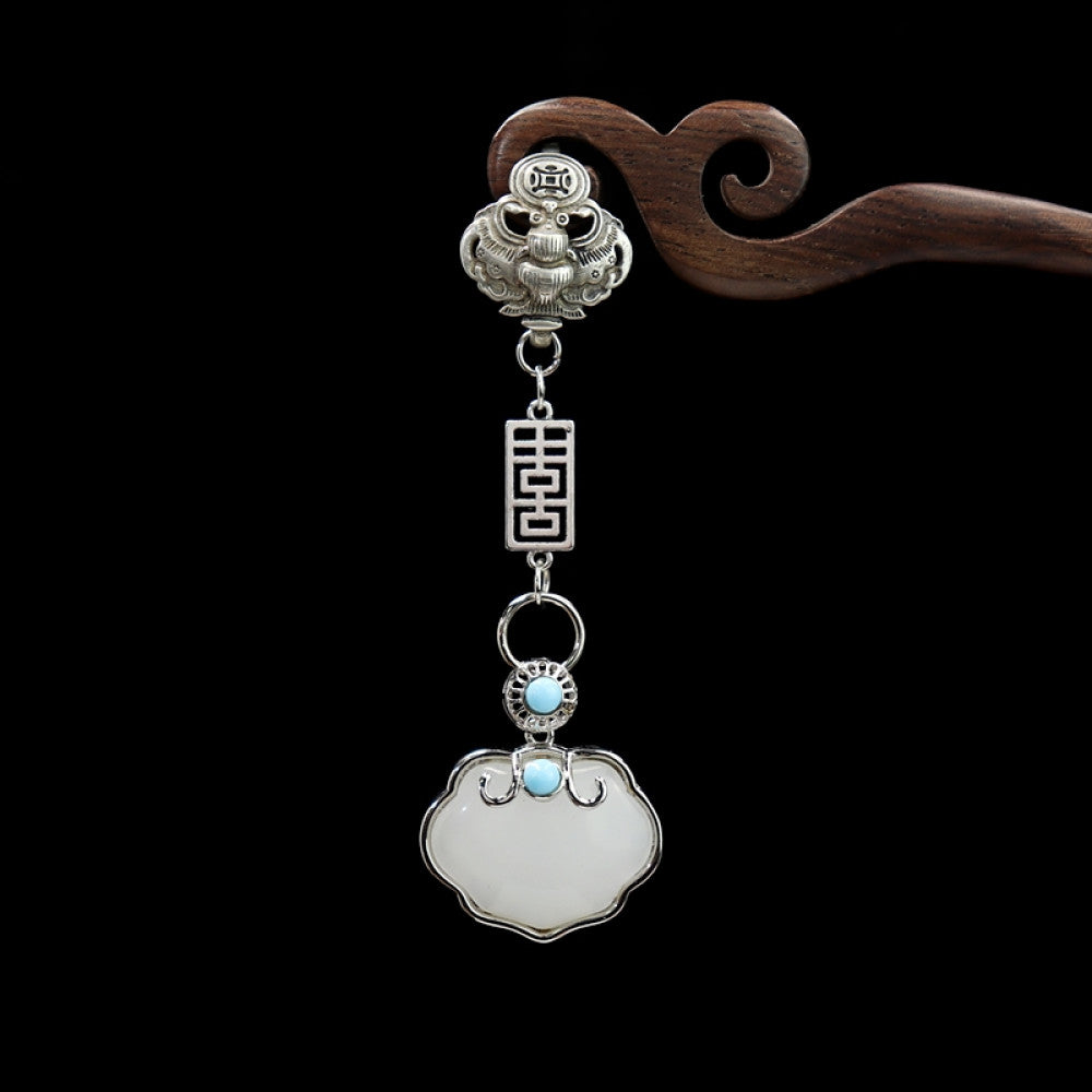 Boho vintage ethnic silver-tone hair pendant featuring lion-shaped decorative clasp, double happiness character detail, light blue bead accent, and a white lock-shaped pendant, styled on a wooden display hook against a black background, ideal for bohemian and traditional fashion enthusiasts in the US