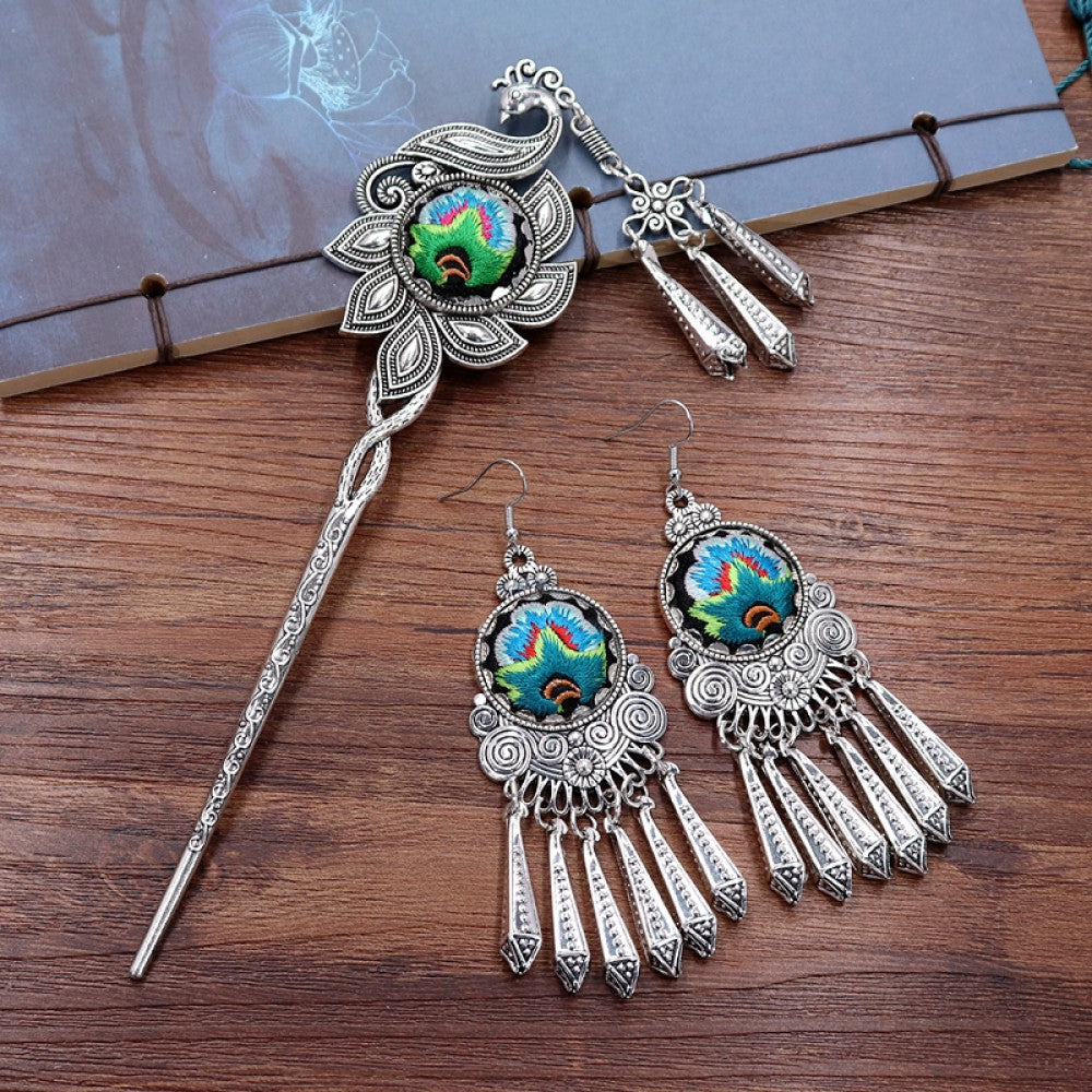 Boho vintage ethnic silver-tone hair stick & earring set (displayed on a wooden surface with a patterned notebook) featuring enamel purple flower details and silver fringe pendants, ideal for bohemian retro or traditional fashion styling in the US 01