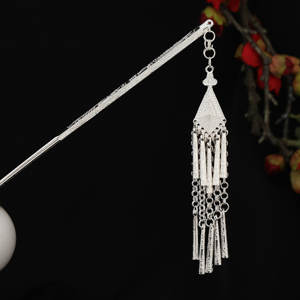 Boho vintage ethnic silver-tone hair stick featuring detailed textured handle, intricate chain network decor, and layered silver tassel pendants, displayed against a black background with red floral accents, ideal for bohemian and traditional fashion enthusiasts in the US 02