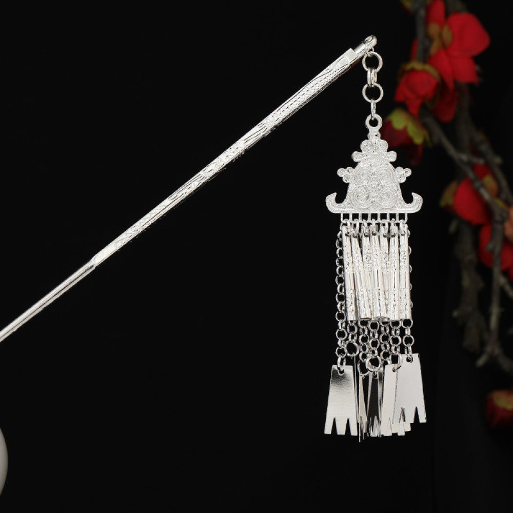 Boho vintage ethnic silver-tone hair stick featuring detailed textured handle, intricate chain network decor, and layered silver tassel pendants, displayed against a black background with red floral accents, ideal for bohemian and traditional fashion enthusiasts in the US 05