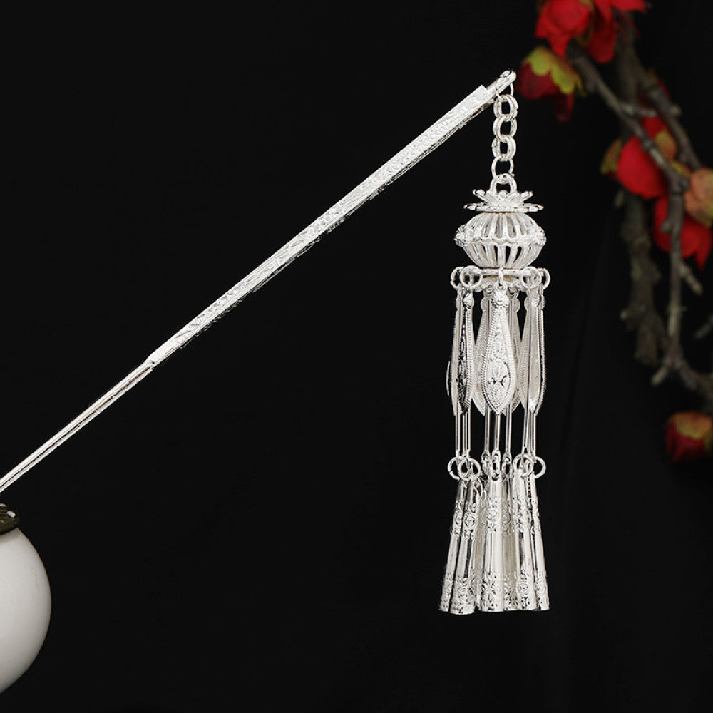 Boho vintage ethnic silver-tone hair stick featuring detailed textured handle, intricate chain network decor, and layered silver tassel pendants, displayed against a black background with red floral accents, ideal for bohemian and traditional fashion enthusiasts in the US 07