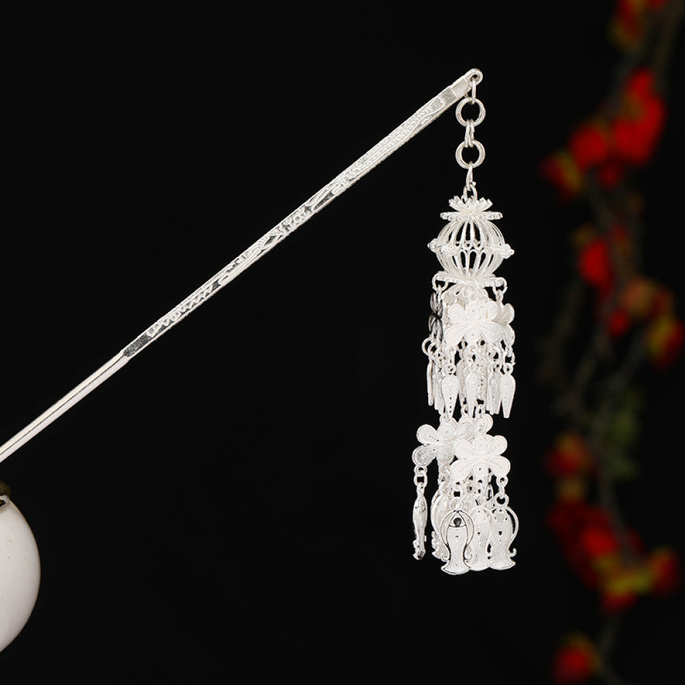 Boho vintage ethnic silver-tone hair stick featuring detailed textured handle, intricate chain network decor, and layered silver tassel pendants, displayed against a black background with red floral accents 01