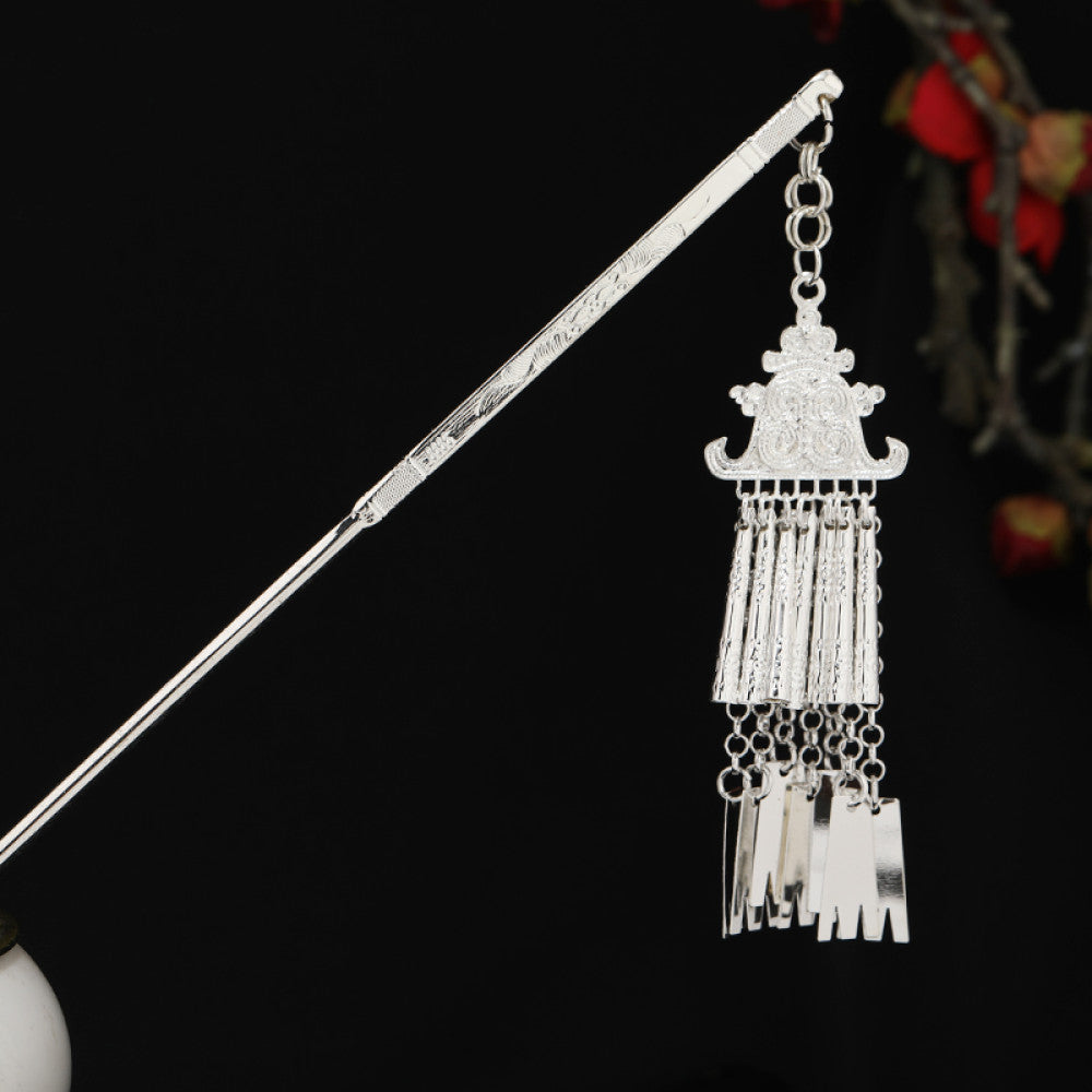 Boho vintage ethnic silver-tone hair stick featuring detailed textured handle, intricate chain network decor, and layered silver tassel pendants, displayed against a black background with red floral accents 14