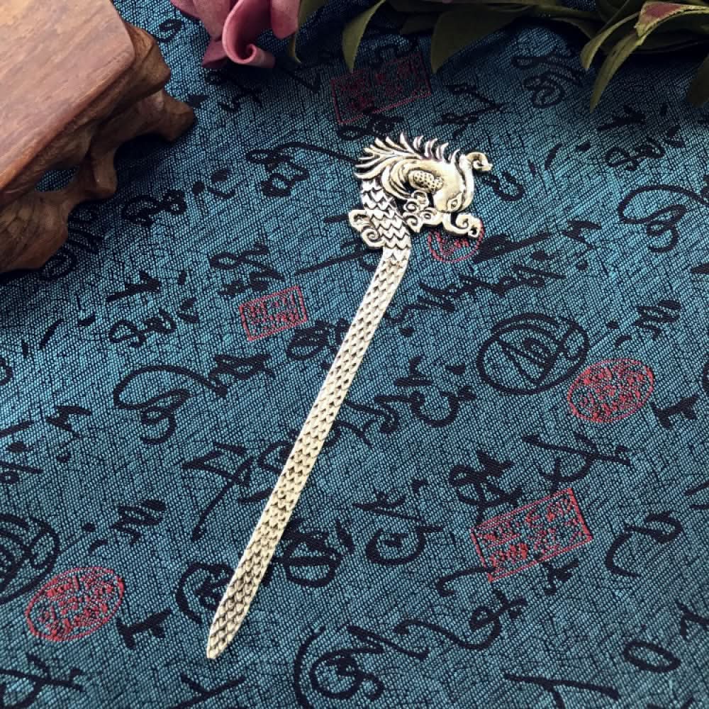 Boho vintage ethnic silver-tone hair stick featuring an intricate curved decorative top, displayed on a blue fabric with text patterns 09