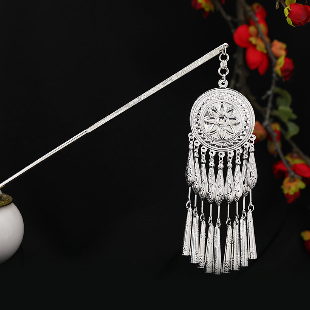 Boho vintage ethnic silver-tone hair stick featuring an intricate rooster-shaped charm, detailed decorative accents, and layered silver tassel pendants, displayed against a black background with red floral decor, ideal for bohemian and traditional fashion enthusiasts in the US 02