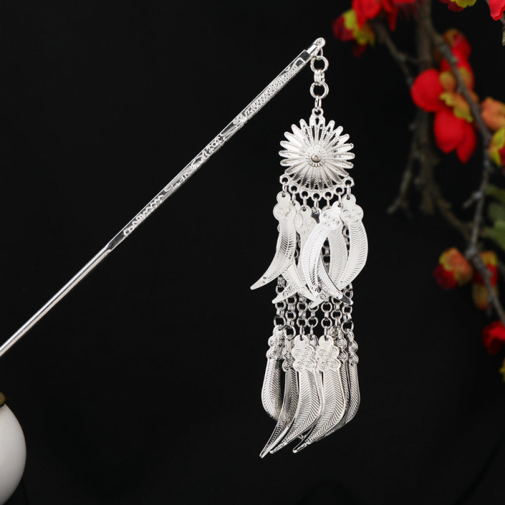 Boho vintage ethnic silver-tone hair stick featuring an intricate rooster-shaped charm, detailed decorative accents, and layered silver tassel pendants, displayed against a black background with red floral decor, ideal for bohemian and traditional fashion enthusiasts in the 06