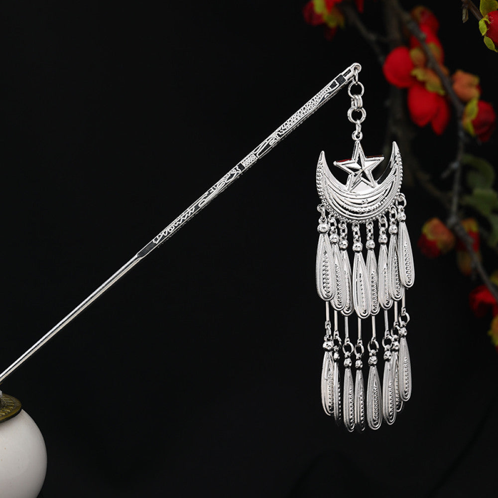 Boho vintage ethnic silver-tone hair stick featuring an intricate rooster-shaped charm, detailed decorative accents, and layered silver tassel pendants, displayed against a black background with red floral decor 08