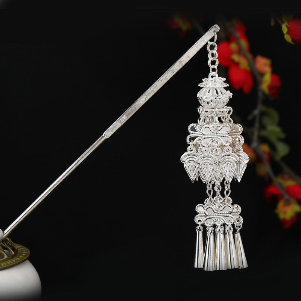 Boho vintage ethnic silver-tone hair stick featuring an intricate rooster-shaped charm, detailed decorative accents, and layered silver tassel pendants, displayed against a black background with red floral decor 10