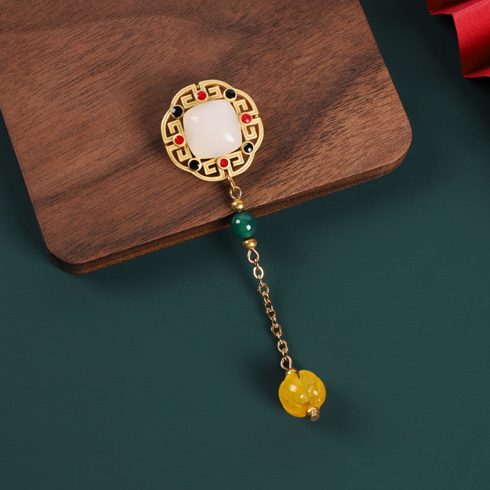 Boho vintage ethnic statement brooch pendant featuring white gemstone, red accents and colorful bead tassel, styled on a wooden tray, ideal for bohemian and traditional fashion enthusiasts in the US 01