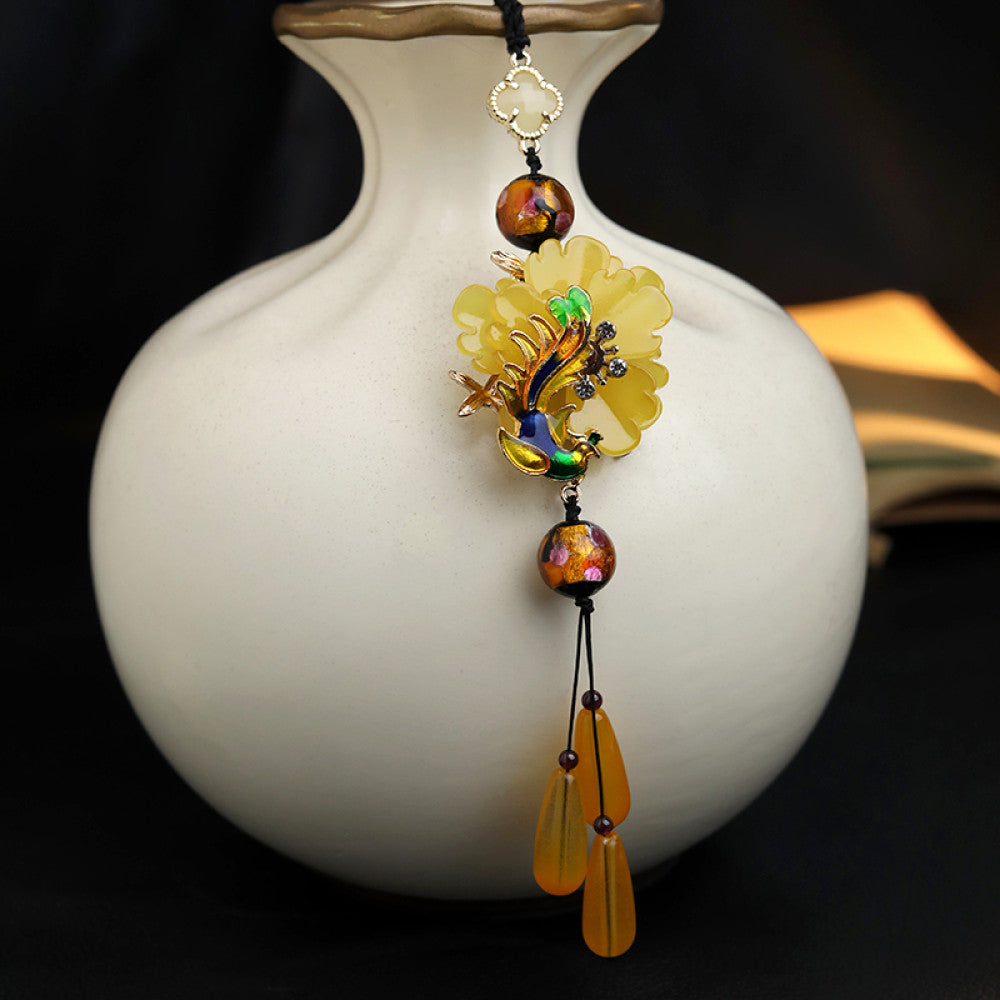 Boho vintage ethnic yellow-tone hair pendant featuring black cord, yellow flower-shaped charm (with multi-color gemstone & gold accents), and yellow teardrop pendants, styled against a black fabric background, ideal for bohemian and traditional fashion enthusiasts in the US 02