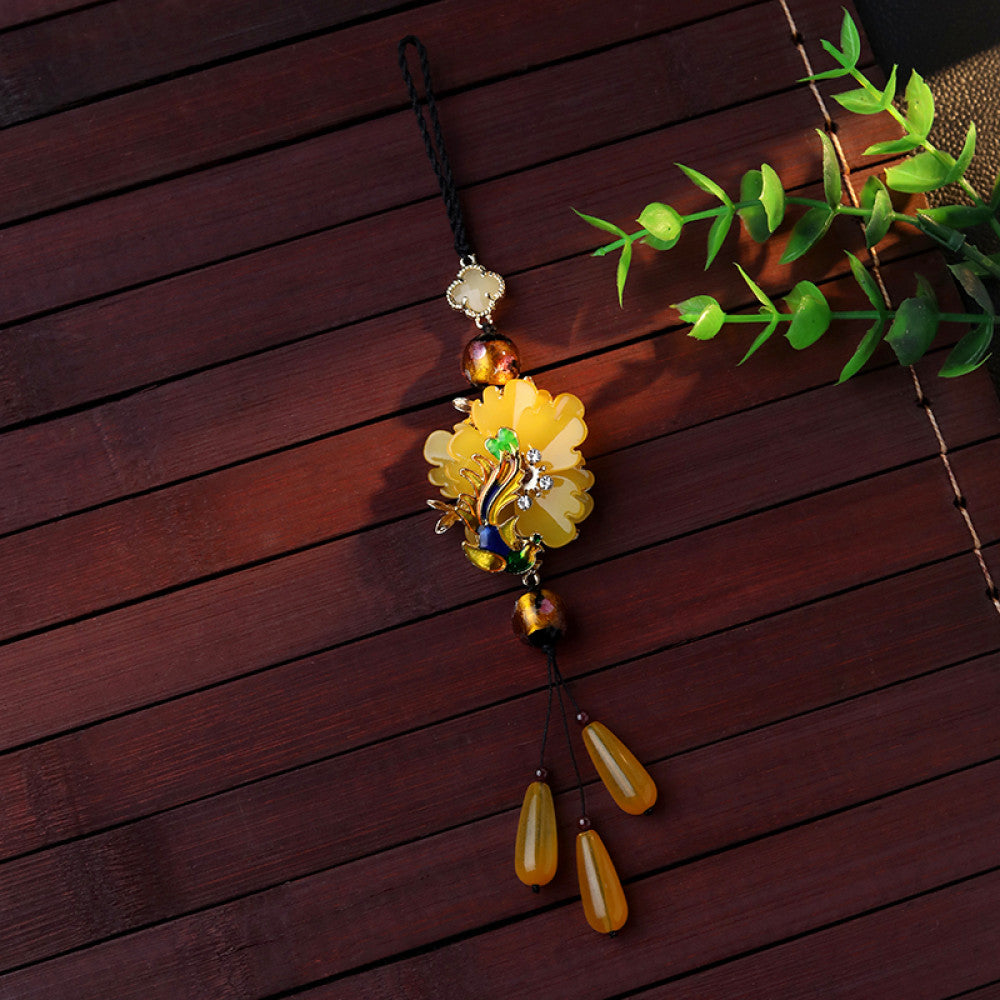 Boho vintage ethnic yellow-tone hair pendant featuring black cord, yellow flower-shaped charm (with multi-color gemstone & gold accents), and yellow teardrop pendants, styled against a black fabric background, ideal for bohemian and traditional fashion enthusiasts in the US 03