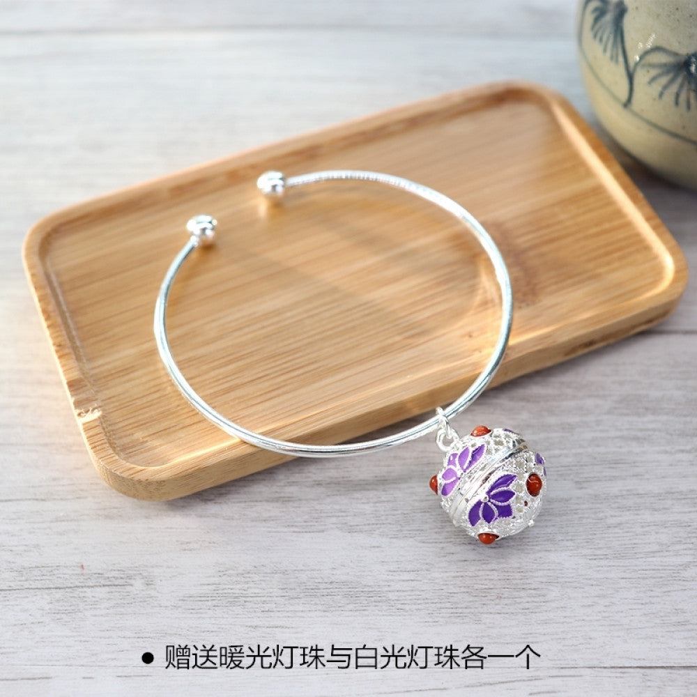 Boho vintage gold bangle with sakura locket charm, styled on wooden tray, ideal for bohemian and floral fashion enthusiasts 12