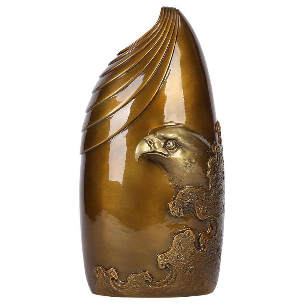 Brass eagle sculpture with textured details, placed on blue surface against dark gradient background 01