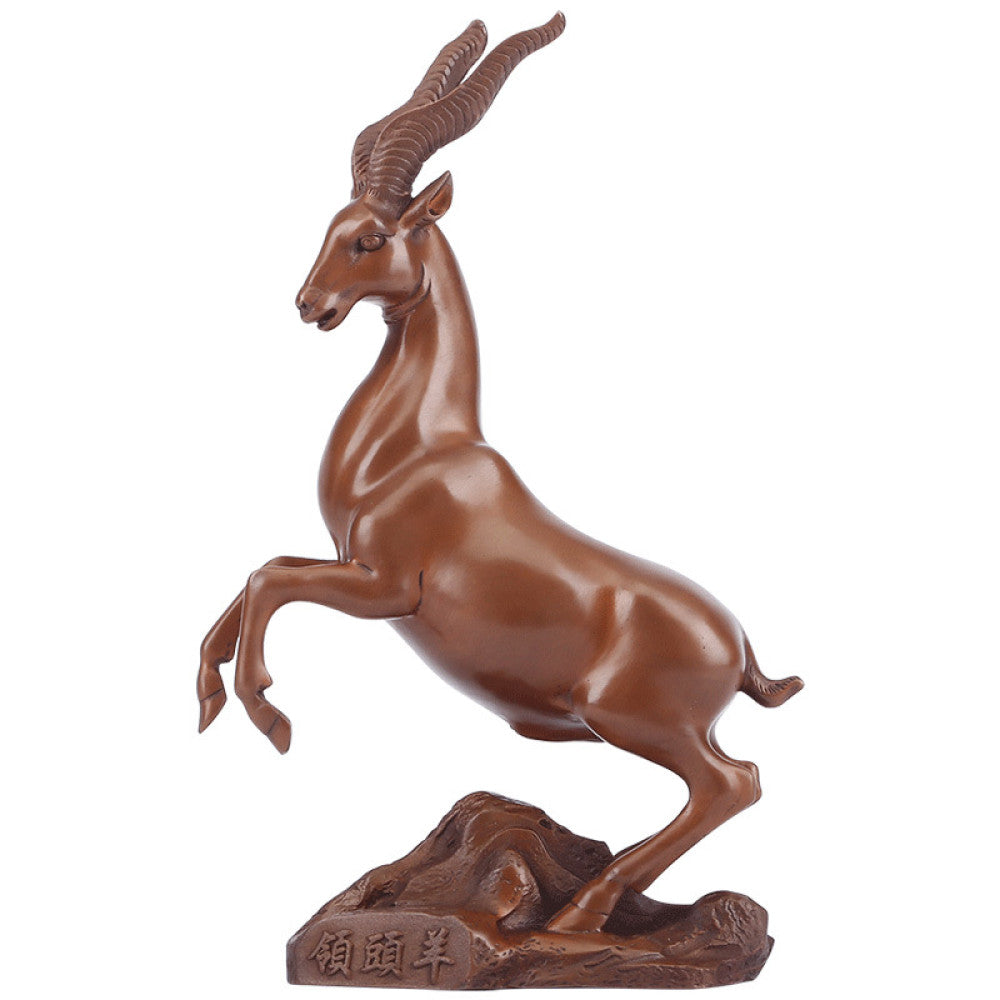 Bronze antelope statue with a leaping stance, a Feng Shui symbol of success and strength, displayed on a wooden base as elegant home decor against a dark blue background 05