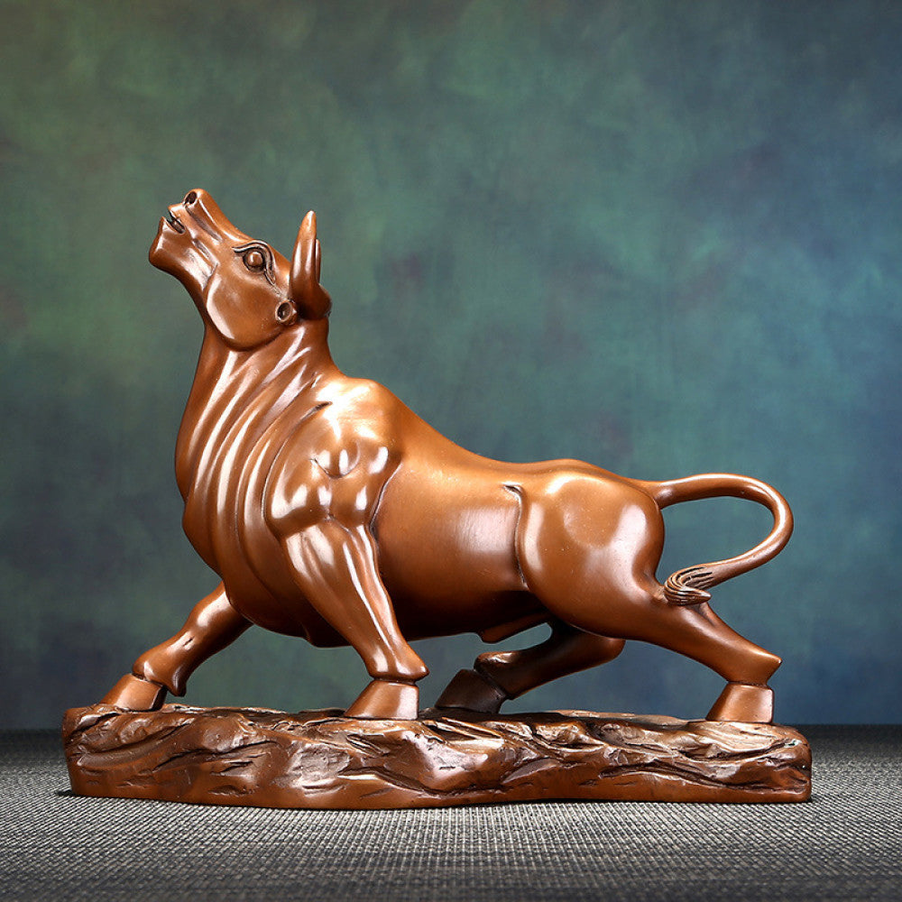 Bronze bull statue with a powerful stance, a Feng Shui symbol of strength and good fortune, displayed as elegant home decor against a textured background