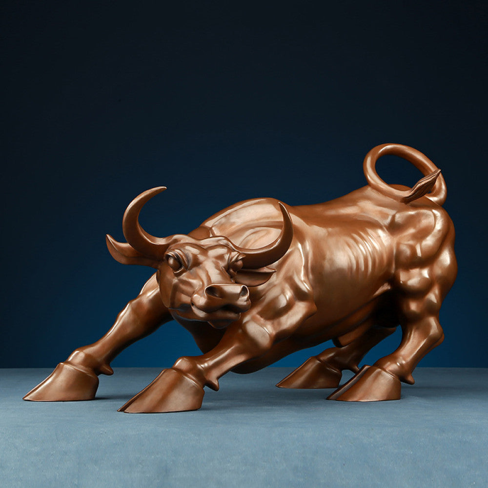 Bronze bull statue with a dynamic charging stance, a Feng Shui symbol of strength and financial fortune, displayed as elegant home decor against a dark blue background 01