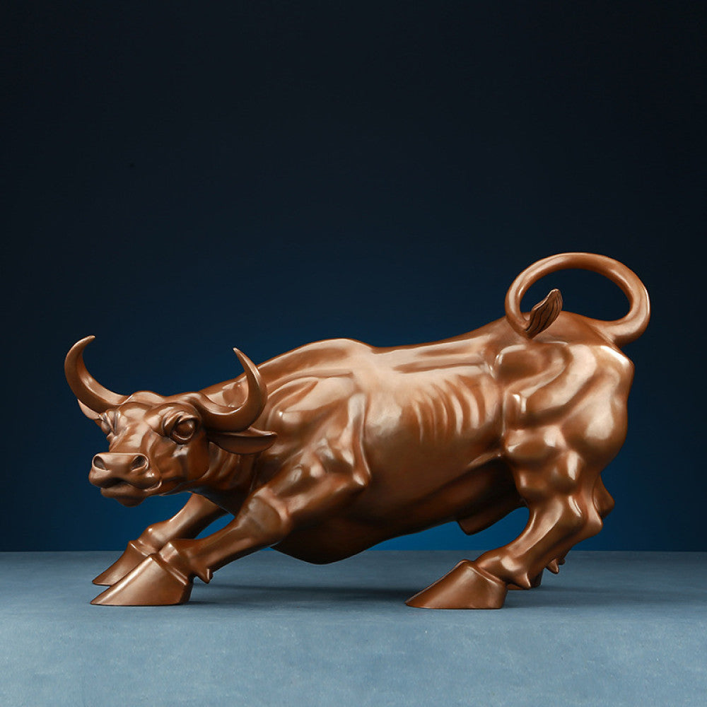 Bronze bull statue with a dynamic charging stance, a Feng Shui symbol of strength and financial fortune, displayed as elegant home decor against a dark blue background 03