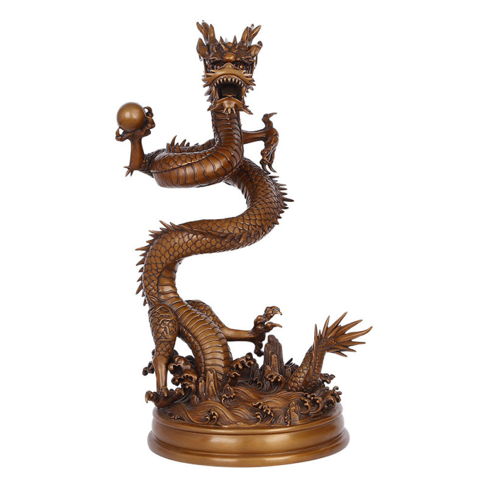 Intricate bronze Chinese dragon statue coiled around a pearl, a symbol of power and good fortune in Feng Shui, displayed on a blue surface against a dark blue background 04
