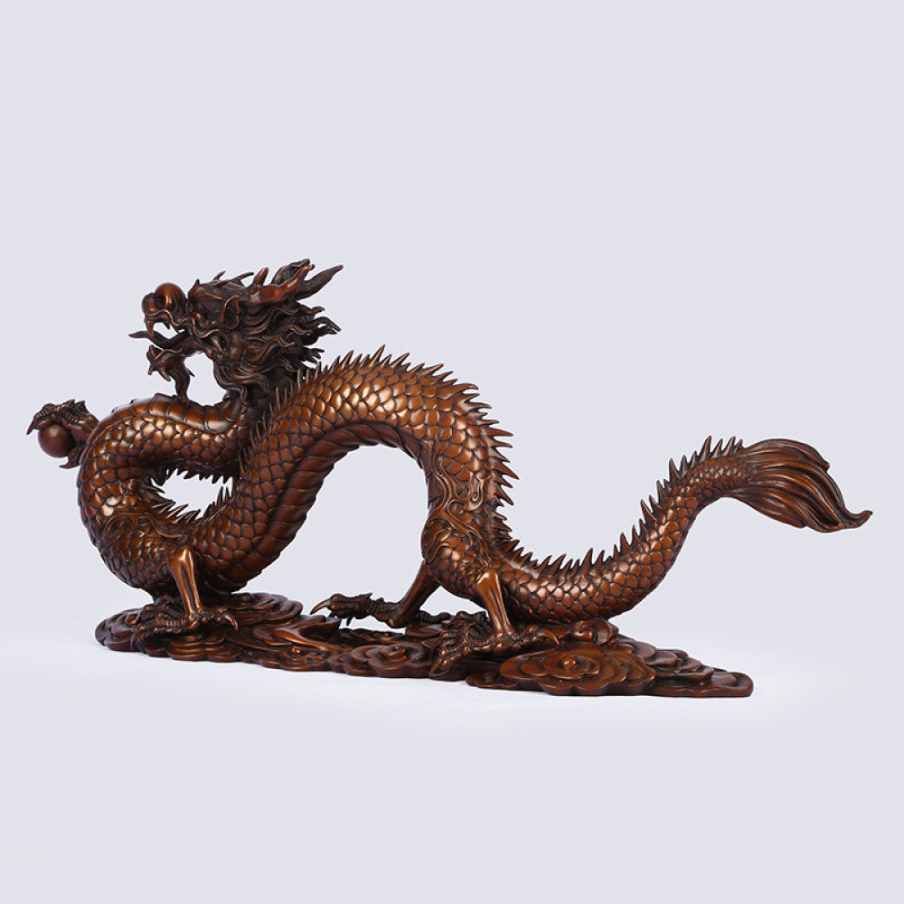 Bronze Chinese dragon statue with intricate scale details, a Feng Shui symbol of good fortune and strength, displayed as elegant home decor against a light background 02