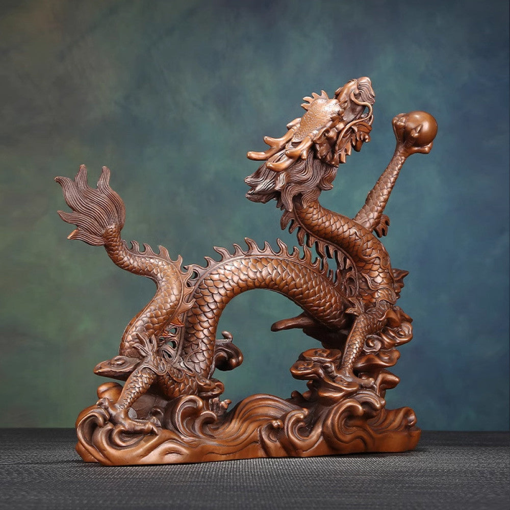 Intricate bronze Chinese dragon statue with detailed scales, a Feng Shui symbol of good fortune and strength, displayed as elegant home decor against a textured background 11