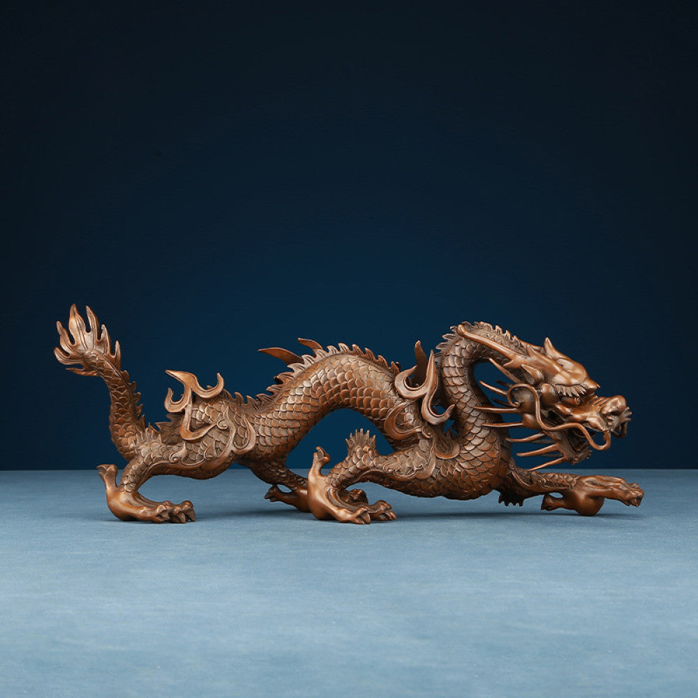 Intricate bronze Chinese dragon statue, a Feng Shui symbol of power and good fortune, displayed as elegant home decor against a dark blue background 03