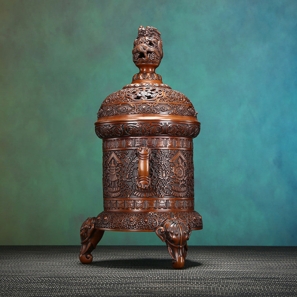 Intricate bronze Chinese incense burner with detailed auspicious carvings, dragon-shaped finial, and elephant-head feet, a Feng Shui symbol of wealth and protection, displayed as an elegant home decor piece against a white background 04
