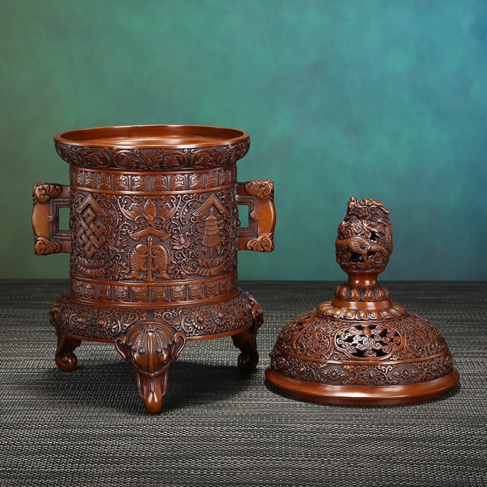 Intricate bronze Chinese incense burner with detailed auspicious carvings, dragon-shaped finial, and elephant-head feet, a Feng Shui symbol of wealth and protection, displayed as an elegant home decor piece against a white background 05