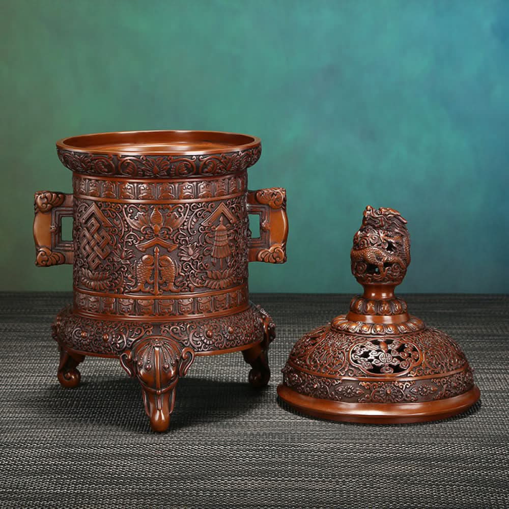 Intricate bronze Chinese incense burner with detailed auspicious carvings, dragon-shaped finial, and elephant-head feet, a Feng Shui symbol of wealth and protection, displayed as an elegant home decor piece against a white background 05