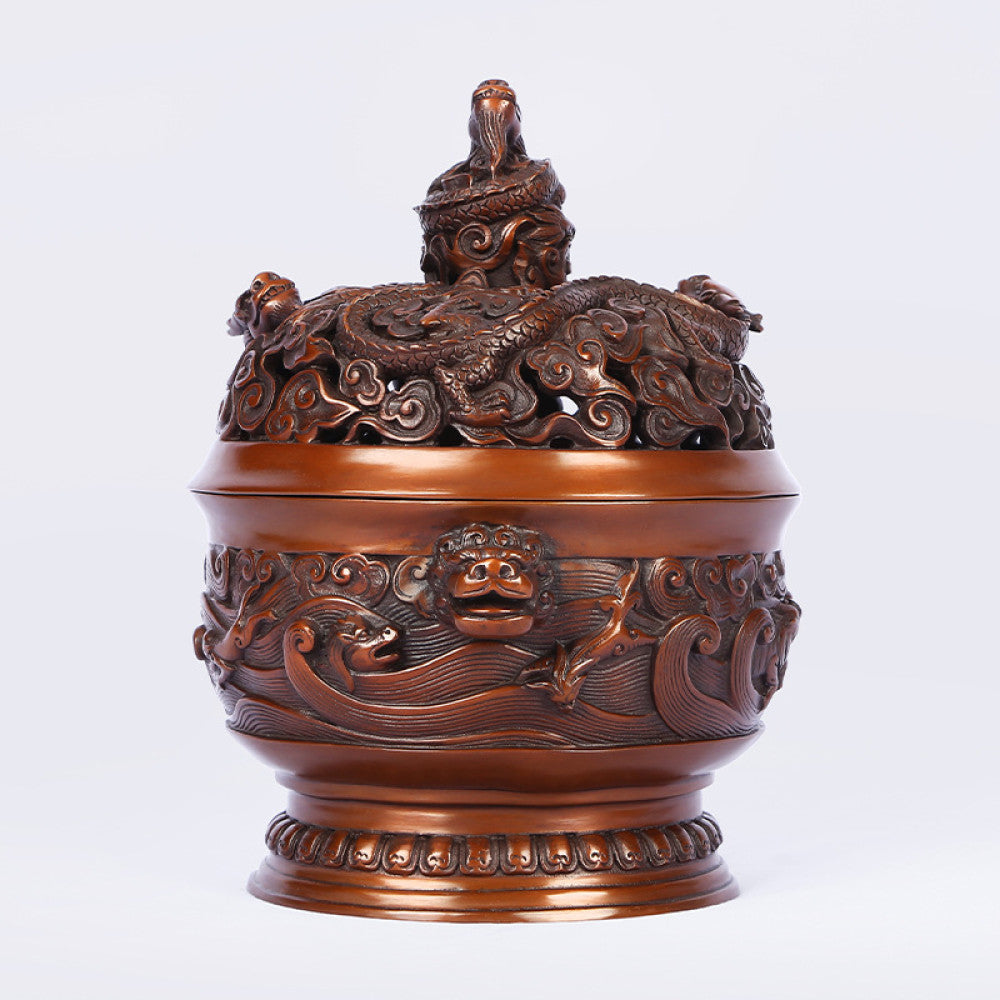Intricate bronze Chinese incense burner with dragon-topped pierced lid, beast-head handles, and wave motifs, a Feng Shui symbol of wealth and protection, displayed as elegant home decor against a white background 01