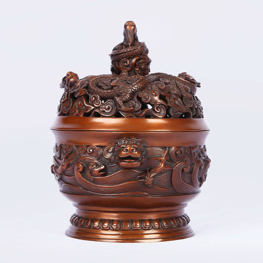 Intricate bronze Chinese incense burner with dragon-topped pierced lid, beast-head handles, and wave motifs, a Feng Shui symbol of wealth and protection, displayed as elegant home decor against a white background 01