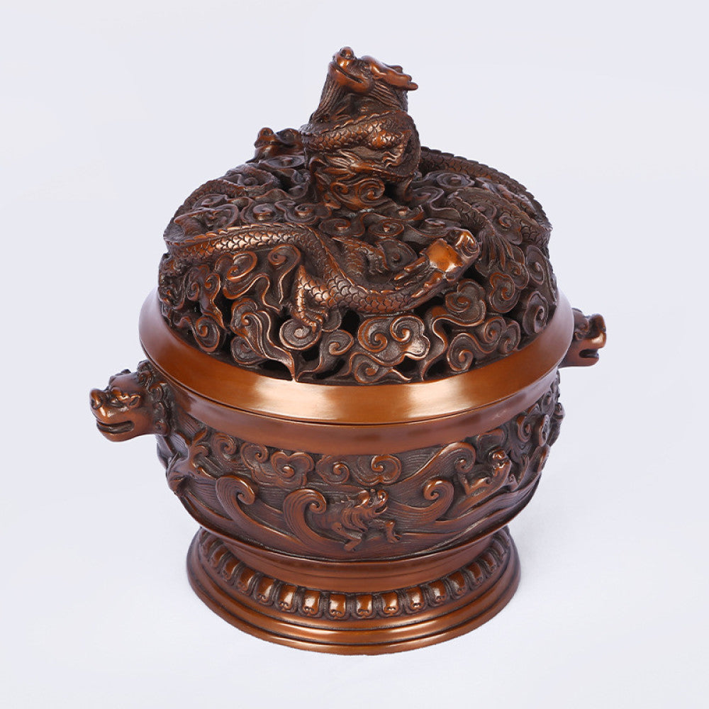 Intricate bronze Chinese incense burner with dragon-topped pierced lid, beast-head handles, and wave motifs, a Feng Shui symbol of wealth and protection, displayed as elegant home decor against a white background 02