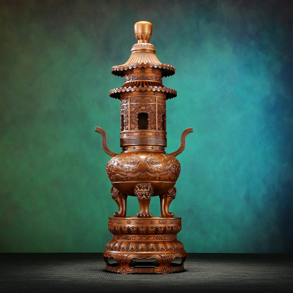 Intricate bronze multi-tiered Chinese incense burner with pagoda-style design, lion-shaped feet, and elaborate carvings, a Feng Shui symbol of wealth and elegance, displayed as a statement home decor piece against a textured teal background