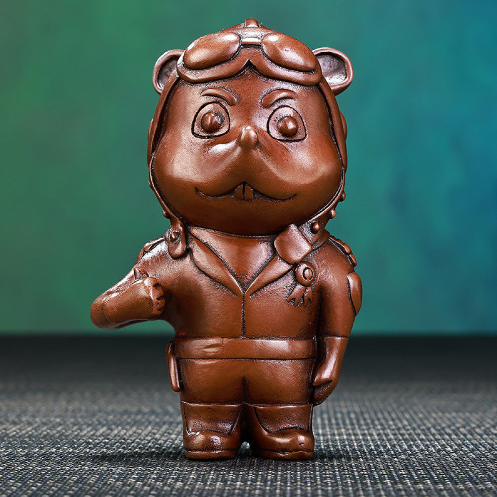 Charming bronze pilot animal statue with detailed aviation gear, a Feng Shui symbol of ambition and success, displayed as unique home decor against a textured background
