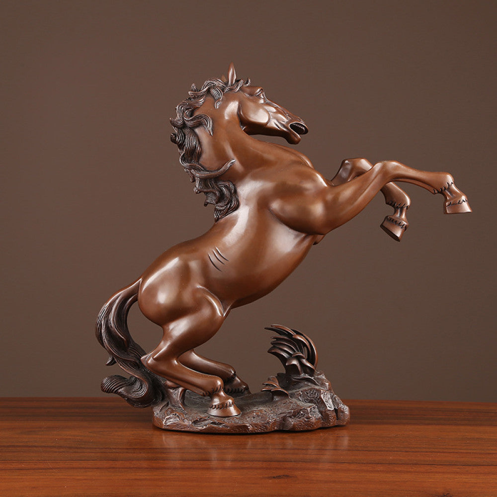 Bronze rearing horse statue with intricate details, symbolizing success and strength, displayed as elegant home decor on a wooden surface against a brown background 01