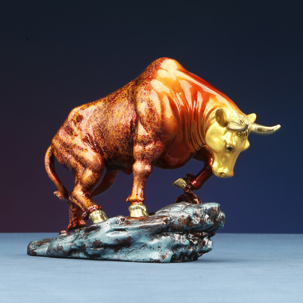 Colorful bull statue with golden accents, a Feng Shui symbol of strength and good fortune, displayed as elegant home decor against a dark background 01