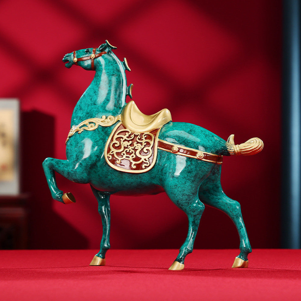 Colorful Chinese - style horse statue with golden accents and intricate patterns, a Feng Shui symbol of good fortune and success, displayed as elegant home decor against a red background 01