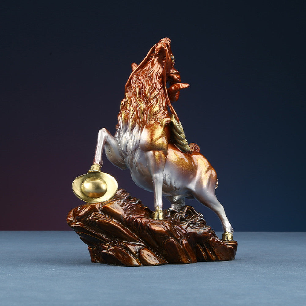 Colorful goat statue with golden details, a Feng Shui symbol of wealth and good fortune, displayed as elegant home decor on a textured base against a dark background