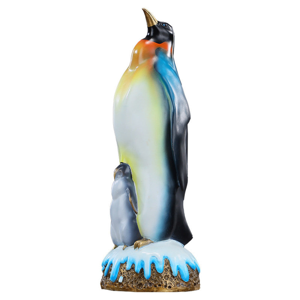 Colorful penguin statue featuring an adult penguin and a chick, designed as a charming home decor accent piece with a snow - themed base, displayed on a wooden surface against a gray background 06