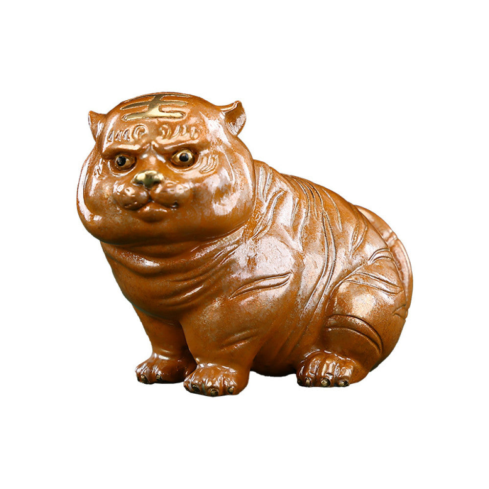 Cute brown chubby tiger figurine with intricate details, a symbol of good luck, placed on a green surface against a blue background 06