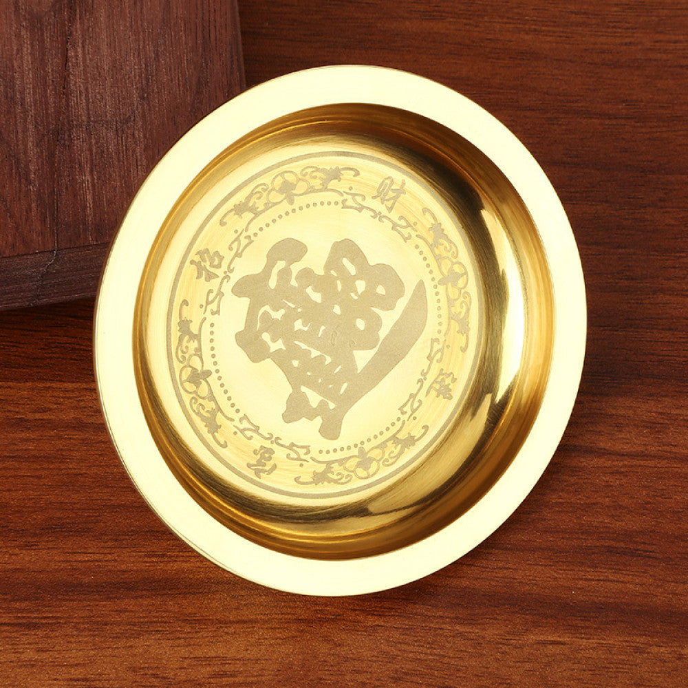 Golden brass handled teapot with lid placed on wooden table against dark background 02