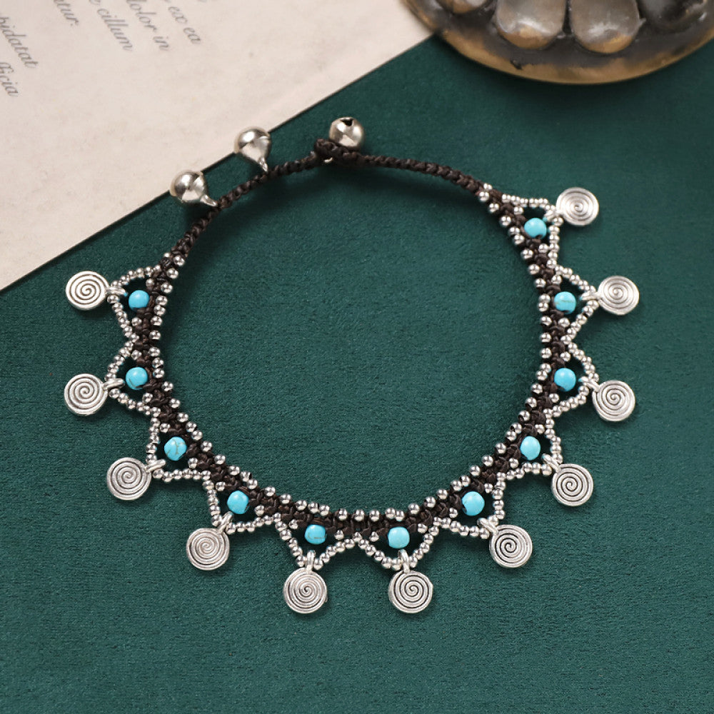 Dainty silver discs paired with tiny turquoise beads, lightweight and elegant.