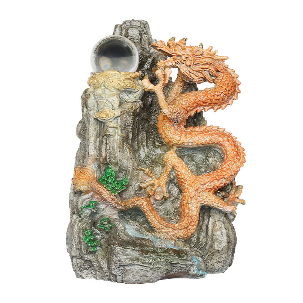 Intricate orange dragon statue with a crystal ball, a Feng Shui symbol of good fortune and strength, displayed as unique home decor on a wooden table against a dark green background 01
