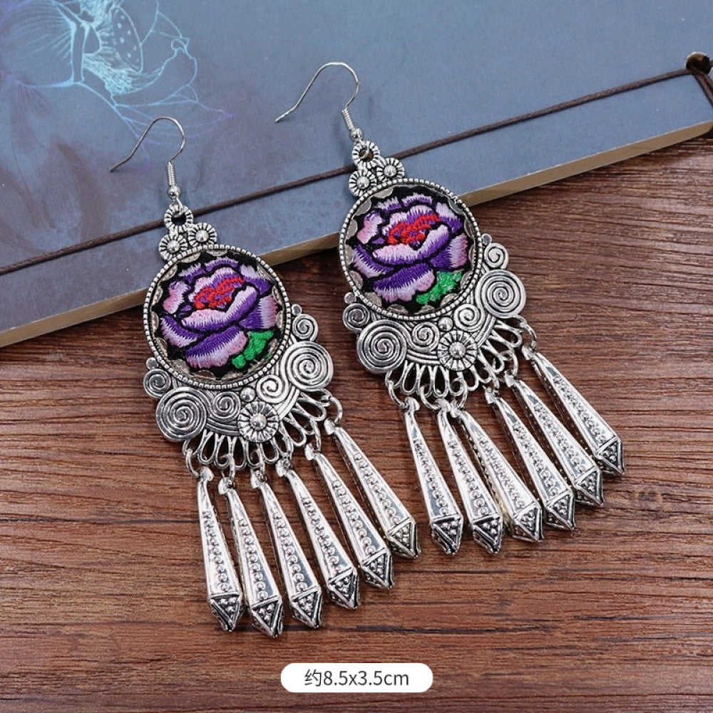 Boho vintage ethnic silver-tone earrings set featuring embroidered lotus details and layered silver bell fringe pendants